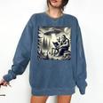 Bigfoot With Alien Reading A Book Bigfoot And UFO Comfort Colors Sweatshirt Blue Jean