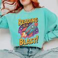 Book Lover Kids And Adults Reading Is a Blast Rocket Ship Comfort Colors Sweatshirt Butter Book Lover Kids And Adults Reading Is a Blast Rocket Ship Comfort Colors Sweatshirt Butter