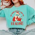 He Sees What You'Ve Been Reading Santa Book Comfort Colors Sweatshirt Butter He Sees What You'Ve Been Reading Santa Book Comfort Colors Sweatshirt Butter