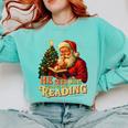 He Sees What You’Ve Been Reading Santa Book Lover Christmas Comfort Colors Sweatshirt Butter He Sees What You’Ve Been Reading Santa Book Lover Christmas Comfort Colors Sweatshirt Butter
