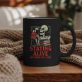 Staying Alive One Book At A Time Skeleton Reading Librarian Graphic Print Coffee Mug Staying Alive One Book At A Time Skeleton Reading Librarian Graphic Print Coffee Mug