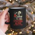 Staying Alive One Book At A Time Skeleton Reading Librarian Graphic Print Coffee Mug Staying Alive One Book At A Time Skeleton Reading Librarian Graphic Print Coffee Mug