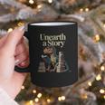Unearth A Story Dinosaur Reading a Library Book Graphic Print Coffee Mug