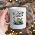 Unearth a Story Frog Reading a Book Summer 2026 Premium Tri-Blend Graphic Print Coffee Mug Unearth a Story Frog Reading a Book Summer 2026 Premium Tri-Blend Graphic Print Coffee Mug