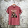 Women's Unearth A Story Dinosaur Reading a Library Book Men's Comfort Colors T-Shirt Crimson