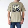 Bigfoot With Alien Reading A Book Bigfoot And UFO Men's Comfort Colors T-Shirt Khaki