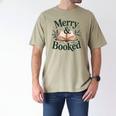 Merry And Booked Holiday Reading Winter Book Lover Premium Tri-Blend Men's Comfort Colors T-Shirt Khaki