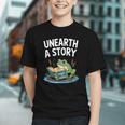 Unearth a Story Frog Reading a Book Summer 2026 Graphic Youth Unearth a Story Frog Reading a Book Summer 2026 Graphic Youth