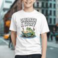 Unearth a Story Frog Reading a Book Summer 2026 Premium Tri-Blend Graphic Youth