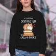 Easily Distracted By Cats And Books Reading Lover Bookish Youth Crewneck Sweatshirt Easily Distracted By Cats And Books Reading Lover Bookish Youth Crewneck Sweatshirt