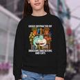 Easily Distracted By Dragons Books Cats Fantasy Book Lover Youth Crewneck Sweatshirt Easily Distracted By Dragons Books Cats Fantasy Book Lover Youth Crewneck Sweatshirt
