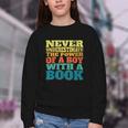 Retro Never Underestimate The Power Of a Boy With a Book Youth Crewneck Sweatshirt