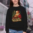 He Sees What You’Ve Been Reading Santa Book Lover Christmas Youth Crewneck Sweatshirt He Sees What You’Ve Been Reading Santa Book Lover Christmas Youth Crewneck Sweatshirt