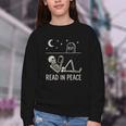 Skeleton Read In Peace Halloween Book Graphic Bookish Youth Crewneck Sweatshirt Skeleton Read In Peace Halloween Book Graphic Bookish Youth Crewneck Sweatshirt