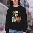 Skeleton Reading Book Christmas Teacher Librarian Book Lover Youth Crewneck Sweatshirt