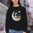 UFO Alien Astronaut Reading Book In Space Youth Crewneck Sweatshirt