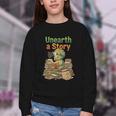 Unearth a Story Triceratops Dinosaur Reading Books Cute Dino Youth Crewneck Sweatshirt Unearth a Story Triceratops Dinosaur Reading Books Cute Dino Youth Crewneck Sweatshirt