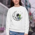 Astronaut Reading Book To Alien Moon Space Astronomy Youth Crewneck Sweatshirt