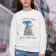 A Book A Day Keeps Reality Away Premium Tri-Blend Youth Crewneck Sweatshirt A Book A Day Keeps Reality Away Premium Tri-Blend Youth Crewneck Sweatshirt