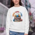 “Books Coffee & Yarn Enthusiast Cozy Reader Youth Crewneck Sweatshirt