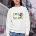 All The-Cool Kids Are Reading Teacher Book Lover Librarian Premium Youth Crewneck Sweatshirt All The-Cool Kids Are Reading Teacher Book Lover Librarian Premium Youth Crewneck Sweatshirt