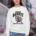 Racoon-Bookworm-Book Bandit-Fueled By Fiction Youth Crewneck Sweatshirt Racoon-Bookworm-Book Bandit-Fueled By Fiction Youth Crewneck Sweatshirt