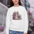 Reading A Book Per Day Keeps Reality Away Skeleton Books Youth Crewneck Sweatshirt