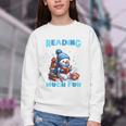 Reading Is Snow Much Fun Christmas Xmas Book Reading Youth Crewneck Sweatshirt Reading Is Snow Much Fun Christmas Xmas Book Reading Youth Crewneck Sweatshirt