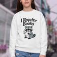I Require Books Raccoon Reading For Book Lovers Youth Crewneck Sweatshirt I Require Books Raccoon Reading For Book Lovers Youth Crewneck Sweatshirt