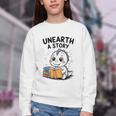 Unearth a Story Cute Dinosaur Summer Reading 2026 Dino Book Youth Crewneck Sweatshirt Unearth a Story Cute Dinosaur Summer Reading 2026 Dino Book Youth Crewneck Sweatshirt