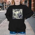 Bigfoot With Alien Reading A Book Bigfoot And UFO Youth Crewneck Sweatshirt