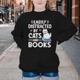 Easily Distracted By Cats And Books Cute Cat And Book Lovers Youth Crewneck Sweatshirt Easily Distracted By Cats And Books Cute Cat And Book Lovers Youth Crewneck Sweatshirt