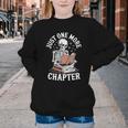 One More Chapter Skeleton Reading Books Lovers Readers Youth Crewneck Sweatshirt