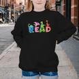 Reading DinosaurRex Dino Book Lover Youth Crewneck Sweatshirt Reading DinosaurRex Dino Book Lover Youth Crewneck Sweatshirt