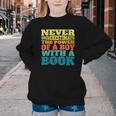 Retro Never Underestimate The Power Of a Boy With a Book Youth Crewneck Sweatshirt
