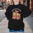 Valentine's Swooning Over Stories Cupid And Book Lover Tee Youth Crewneck Sweatshirt Valentine's Swooning Over Stories Cupid And Book Lover Tee Youth Crewneck Sweatshirt