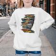 Book Women Graphic Art Colorful Eyes Youth Crewneck Sweatshirt Book Women Graphic Art Colorful Eyes Youth Crewneck Sweatshirt