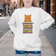 Cute Orange Tabby Cat Reading On Pile Of Books Youth Crewneck Sweatshirt Cute Orange Tabby Cat Reading On Pile Of Books Youth Crewneck Sweatshirt
