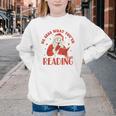 He Sees What You'Ve Been Reading Santa Book Youth Crewneck Sweatshirt He Sees What You'Ve Been Reading Santa Book Youth Crewneck Sweatshirt