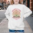 Unearth a Story 2026 Summer Reading Program Flowers Book Premium Tri-Blend Youth Crewneck Sweatshirt Unearth a Story 2026 Summer Reading Program Flowers Book Premium Tri-Blend Youth Crewneck Sweatshirt