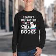 Easily Distracted By Cats And Books Cute Cat And Book Lovers Youth Crewneck Sweatshirt Easily Distracted By Cats And Books Cute Cat And Book Lovers Youth Crewneck Sweatshirt
