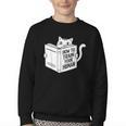Cat Book Humor How To Train Your Human Youth Crewneck Sweatshirt Cat Book Humor How To Train Your Human Youth Crewneck Sweatshirt