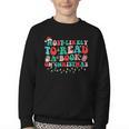 Groovy Christmas Most Likely To Read A Book On Christmas Youth Crewneck Sweatshirt Groovy Christmas Most Likely To Read A Book On Christmas Youth Crewneck Sweatshirt
