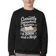Somewhere Between a Book And a Nap – Cozy Reading Youth Crewneck Sweatshirt Somewhere Between a Book And a Nap – Cozy Reading Youth Crewneck Sweatshirt