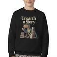 Unearth A Story Dinosaur Reading a Library Book Youth Crewneck Sweatshirt