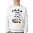 Unearth a Story Cute Dinosaur Summer Reading 2026 Dino Book Youth Crewneck Sweatshirt Unearth a Story Cute Dinosaur Summer Reading 2026 Dino Book Youth Crewneck Sweatshirt