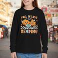 Fall In Love With Reading Thanksgiving Pumpkin Book Lover Youth Long Sleeve Tee Fall In Love With Reading Thanksgiving Pumpkin Book Lover Youth Long Sleeve Tee