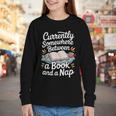 Somewhere Between a Book And a Nap – Cozy Reading Youth Long Sleeve Tee Somewhere Between a Book And a Nap – Cozy Reading Youth Long Sleeve Tee
