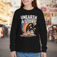 Unearth A Story Rainbow Treasure Book Youth Long Sleeve Tee Unearth A Story Rainbow Treasure Book Youth Long Sleeve Tee