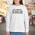 Be Careful Or You’Ll End Up In My Book Youth Long Sleeve Tee Be Careful Or You’Ll End Up In My Book Youth Long Sleeve Tee